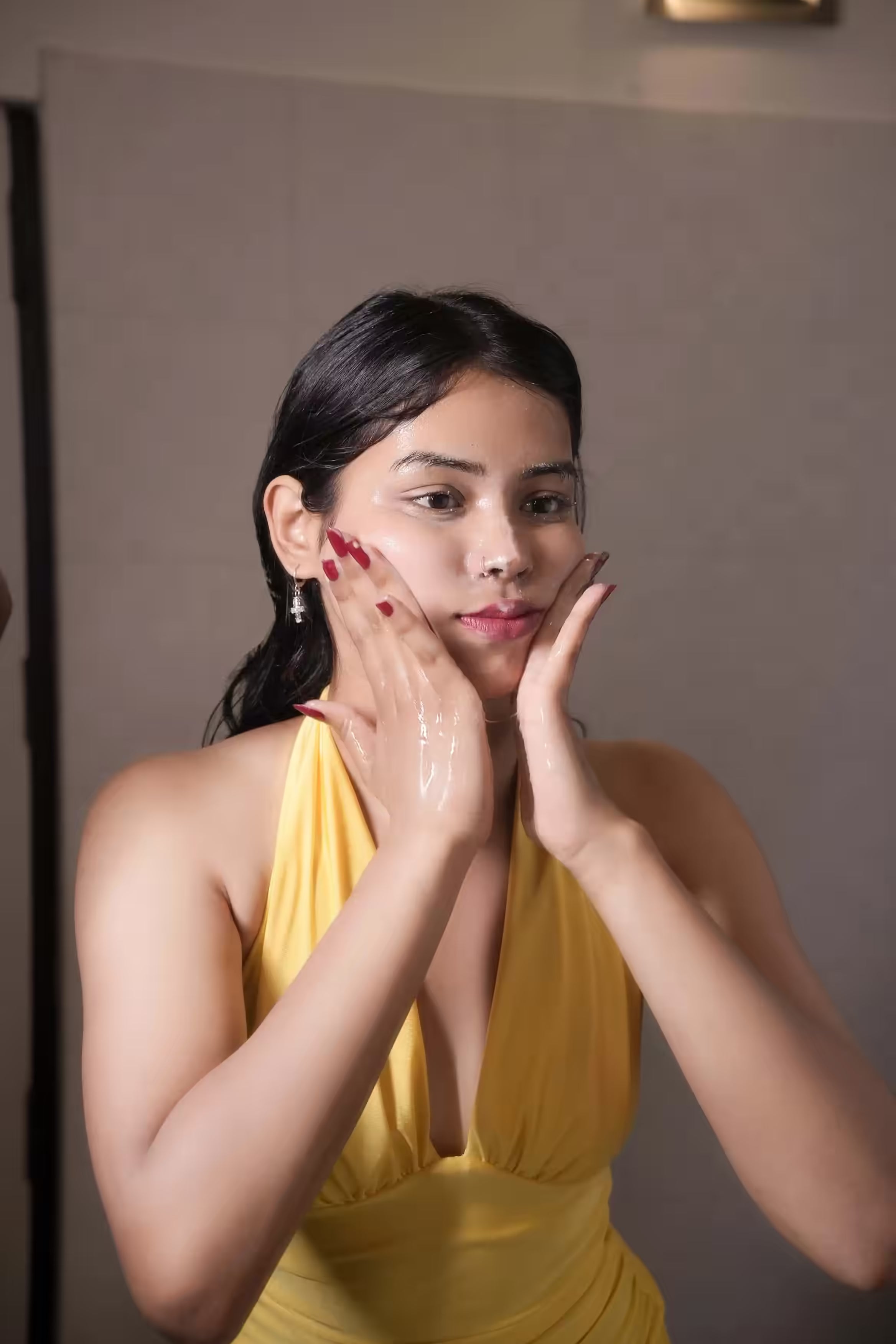 Massage gently across the face using circular motions to activate the beads